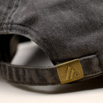 Macro view of the clasp on the Hologram Electronics logo hat