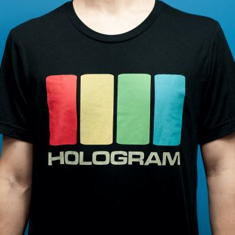 Close-up view of a model wearing the Hologram Electronics Logo T-Shirt