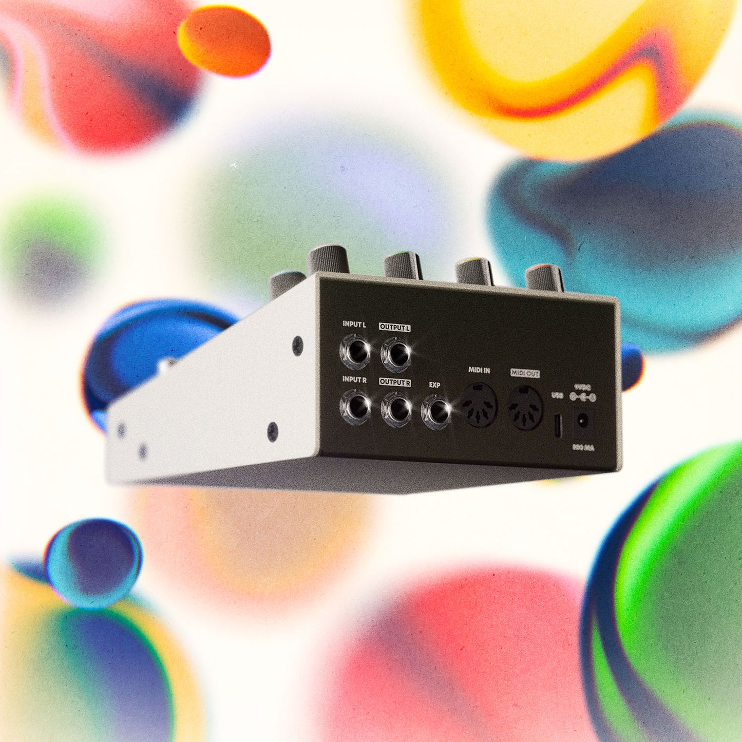 Clear view of the back side of the Hologram Electronics Chroma Console multi-effect pedal showing the inputs and outputs